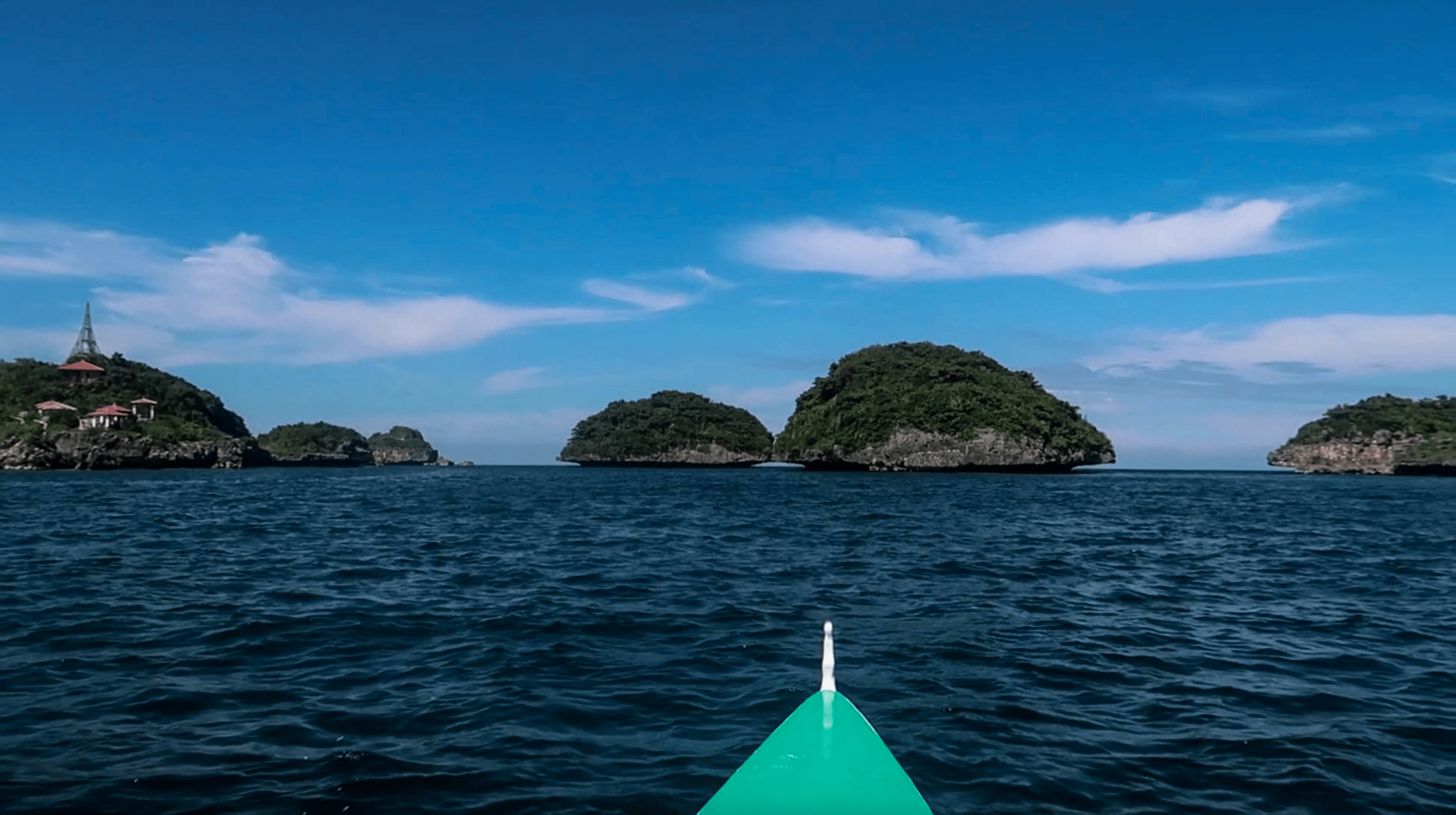 boat riding through hundred islands nature park in pangasinan philippines